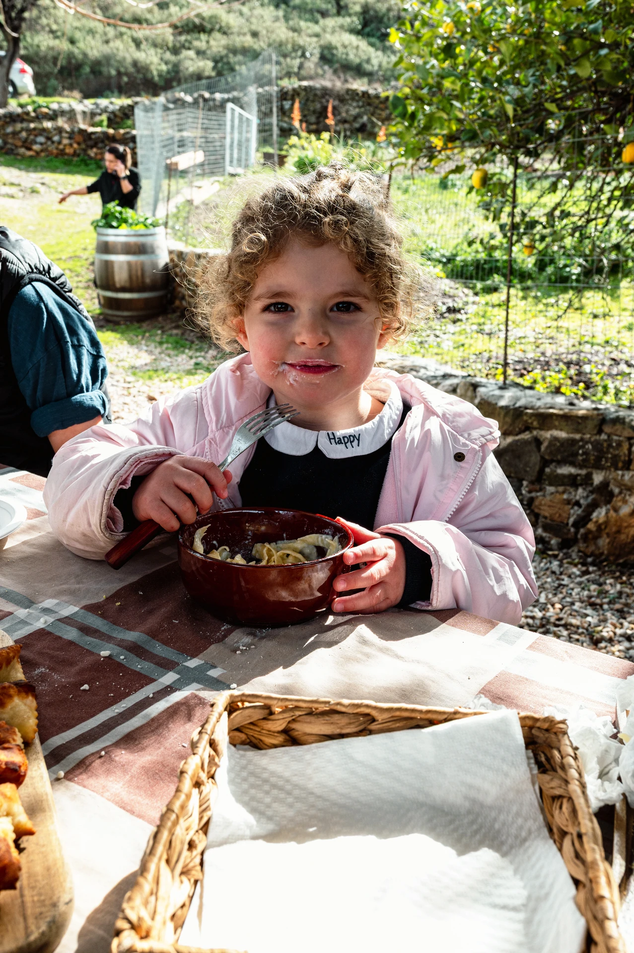 Little Girl Eating at Arevitis Farm Chania Crete